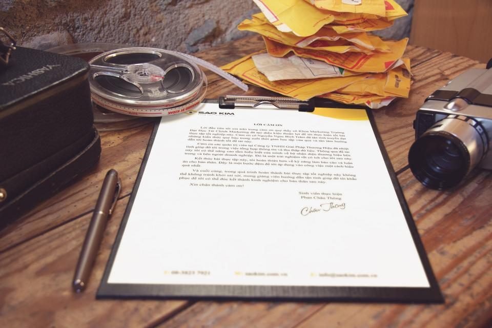 Documents, folders and coins on an office desk